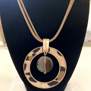 Gold tone and Animal Print Reversible Pendant on Double Leather Cord